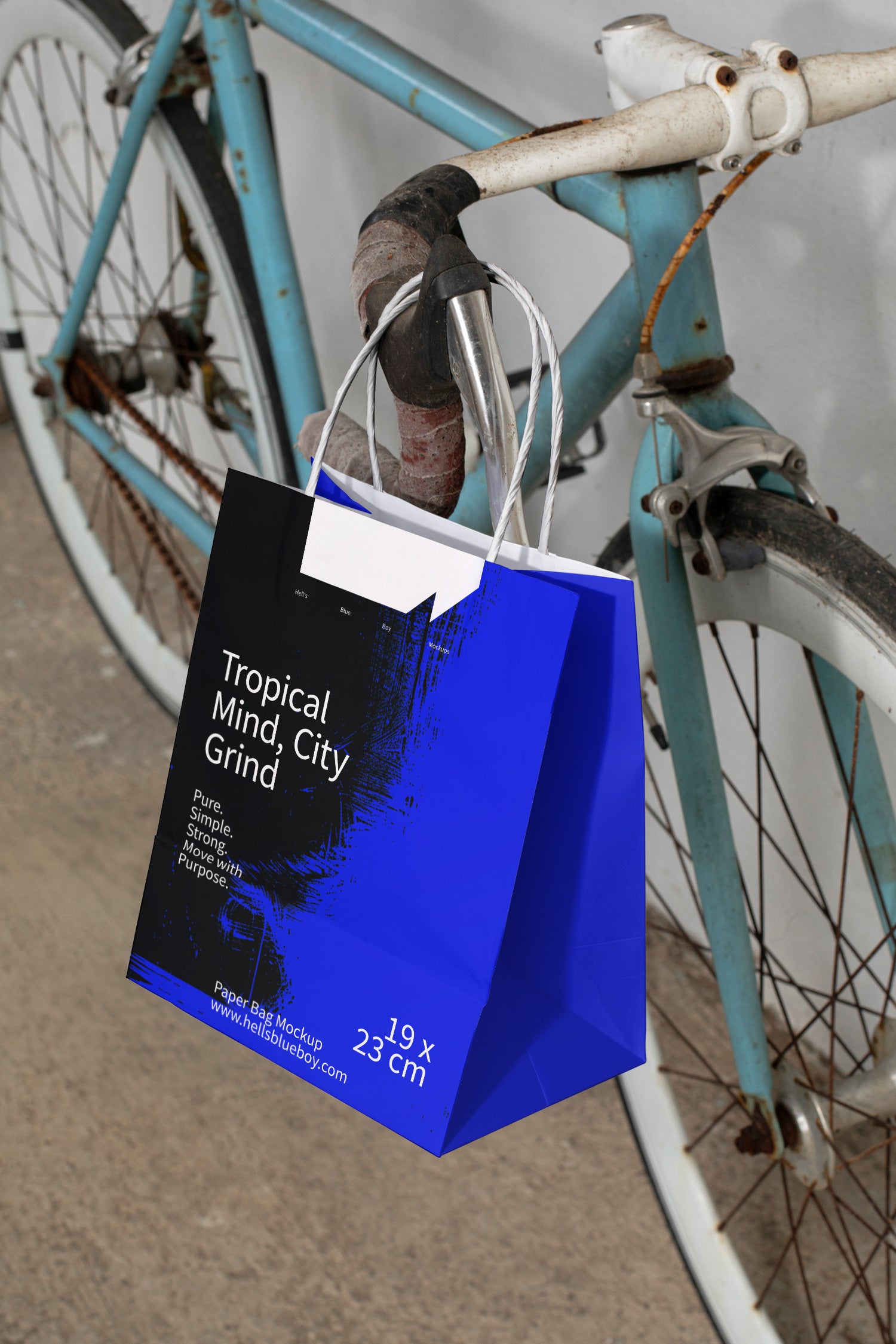 Paper bag mockup hanging on a racing bike handlebar in 80s style.