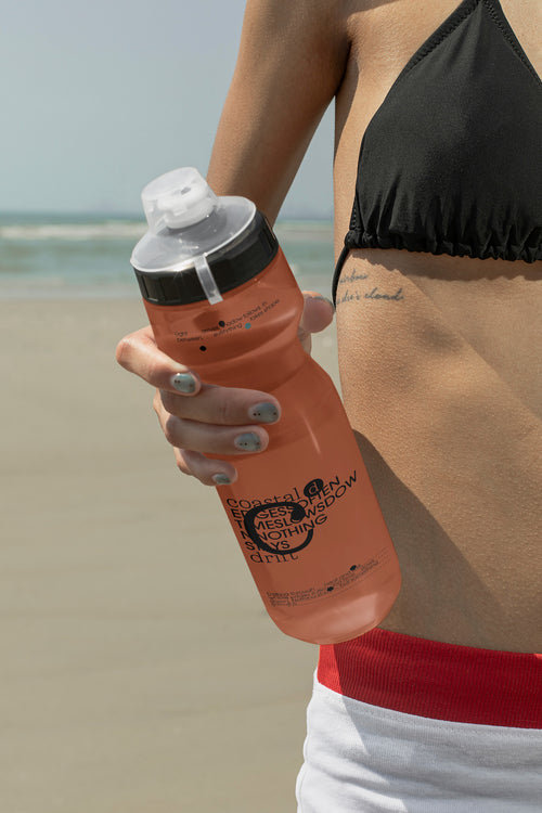 Translucent drinking bottle mockup held by hand. Ideal for showcasing beverage branding, outdoor products, wellness brands, and lifestyle concepts.