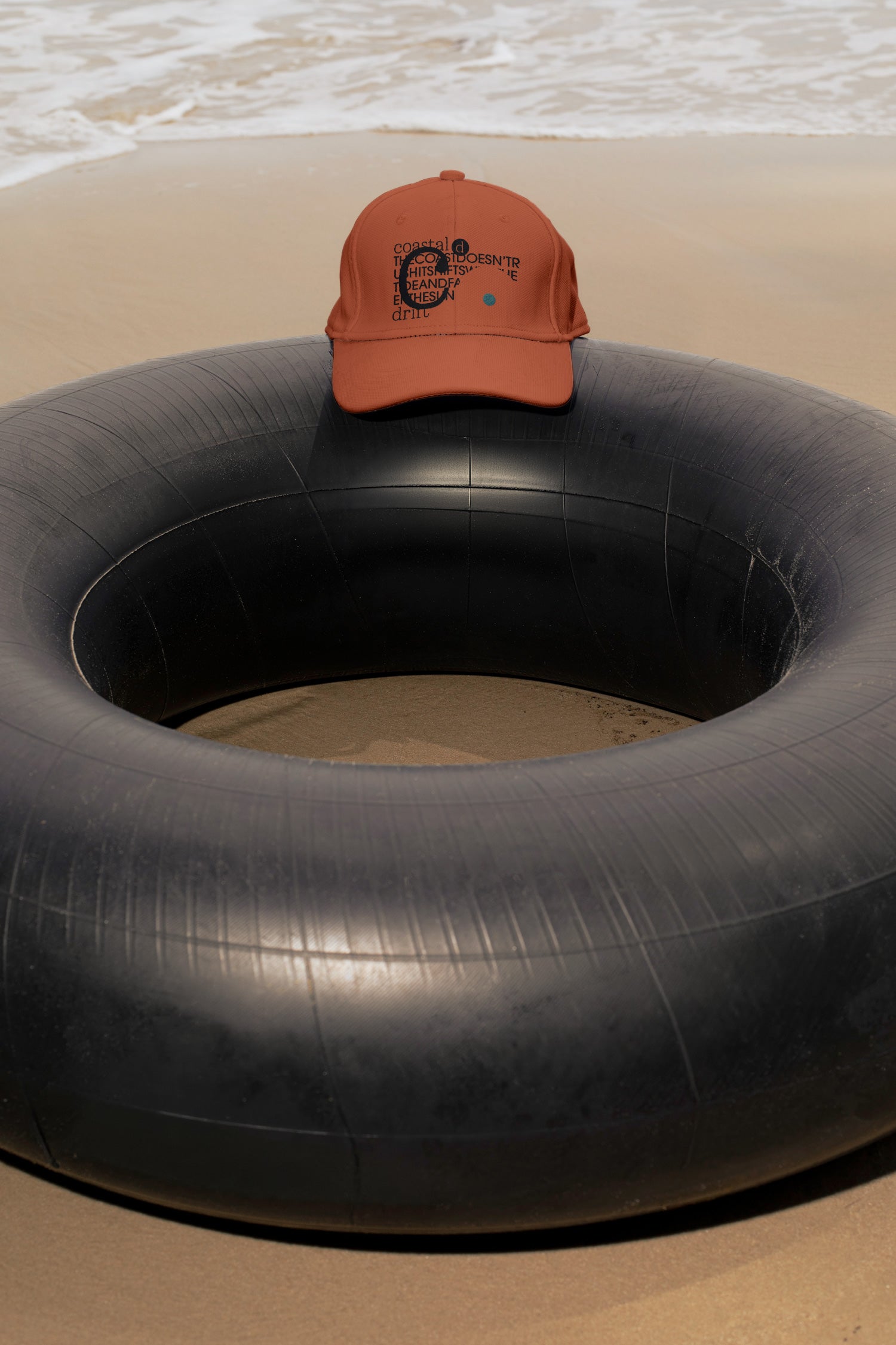 Cap mockup placed on a traditional Thai inner tube float at the beach in Hua Hin, Thailand. Choose between a realistic embroidery effect or a clean graphic application.