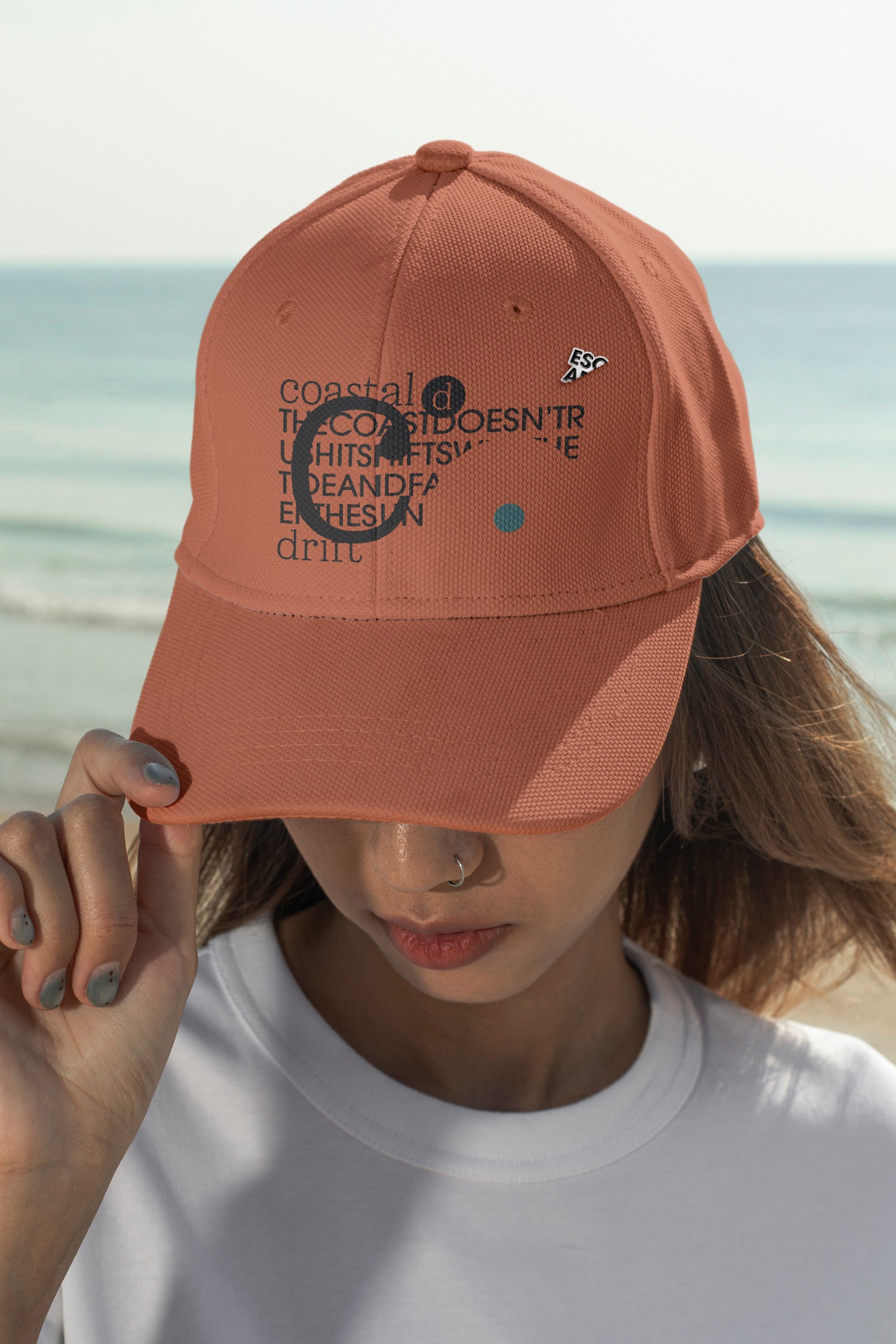 Cap mockup. Features optional embroidery and a customizable lapel pin for more tactile and realistic brand presentations.