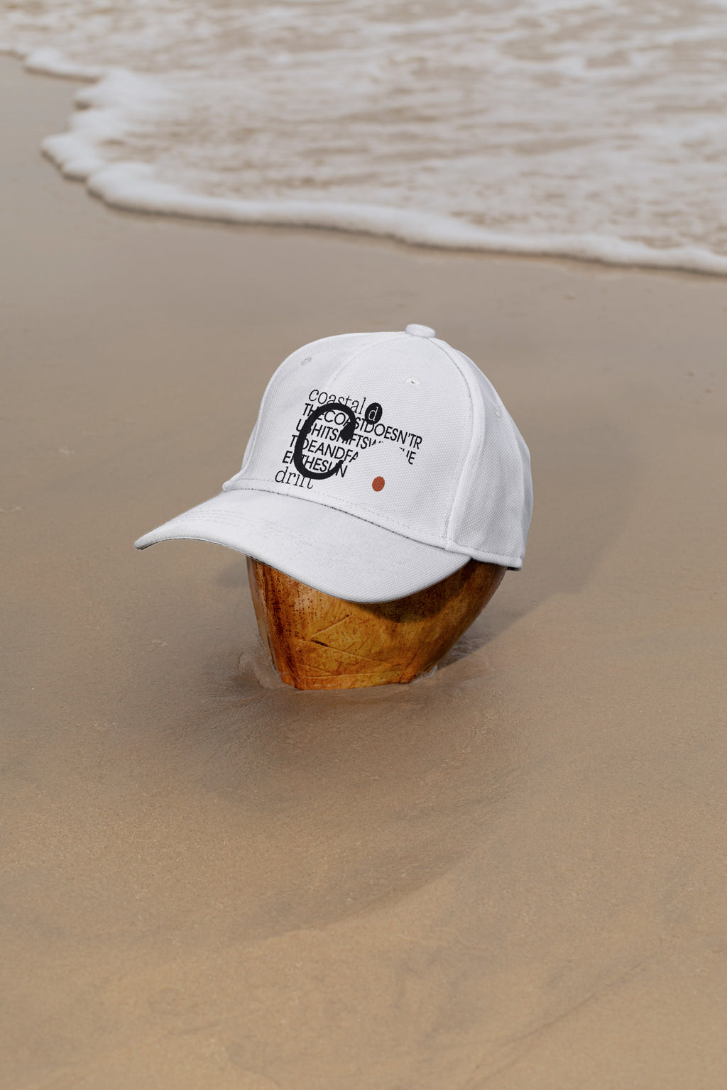 Cap mockup placed on a coconut at the beach in Hua Hin, Thailand. Built for showcasing fashion, lifestyle, branding, and editorial concepts.