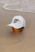 Cap mockup placed on a coconut at the beach in Hua Hin, Thailand. Built for showcasing fashion, lifestyle, branding, and editorial concepts.