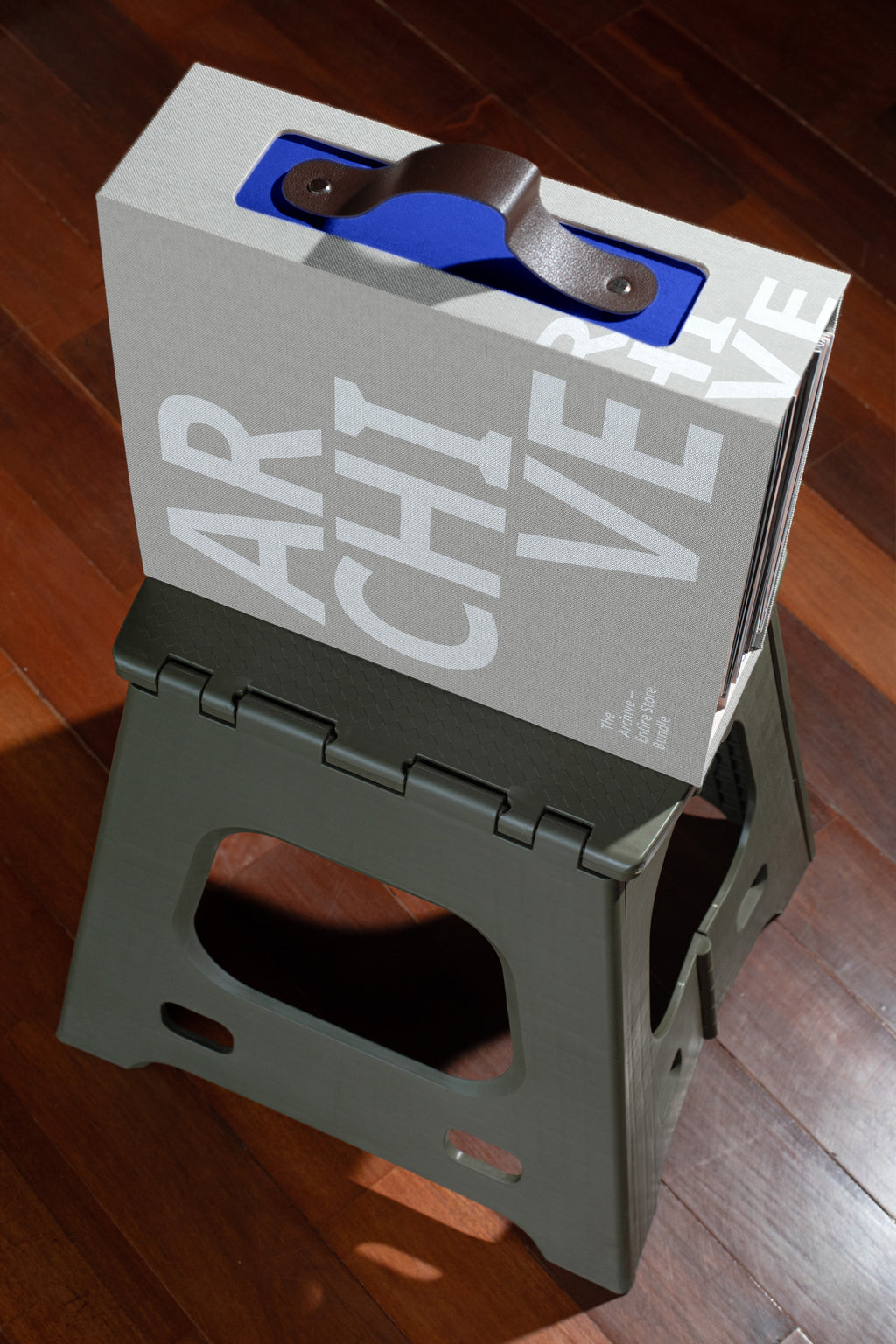 Linen archive folder on plastic stool