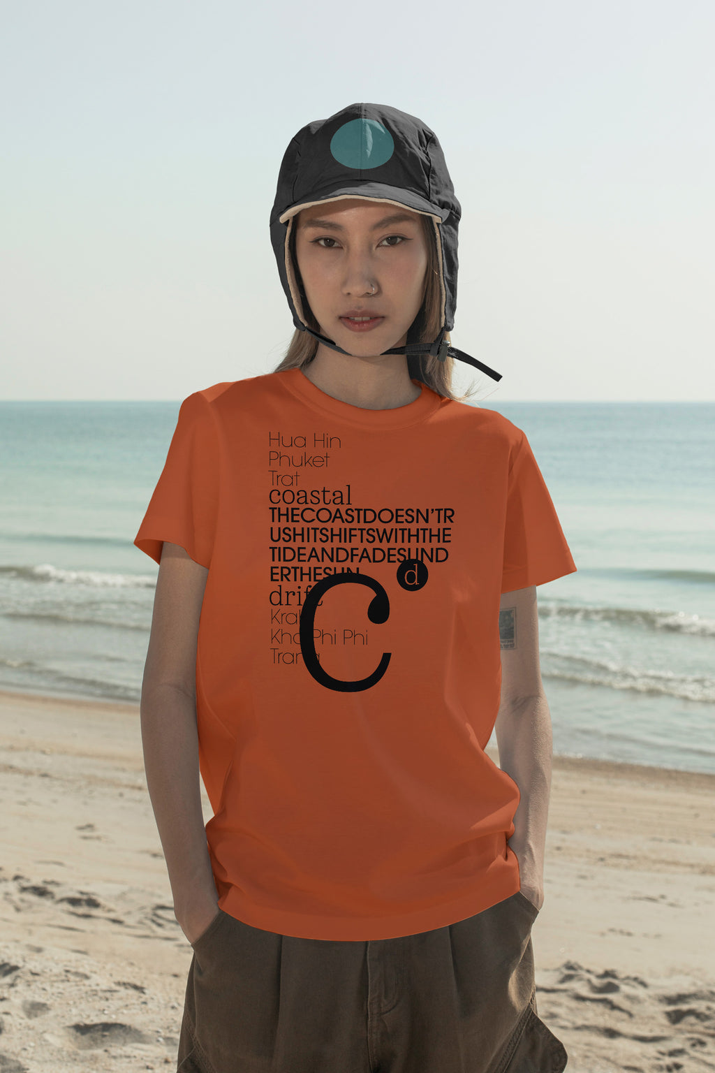 Flap cap and T-shirt mockups worn by local creative Nae along the coast of Hua Hin, Thailand. Built for showcasing apparel brands, fashion collections, and lifestyle identities.