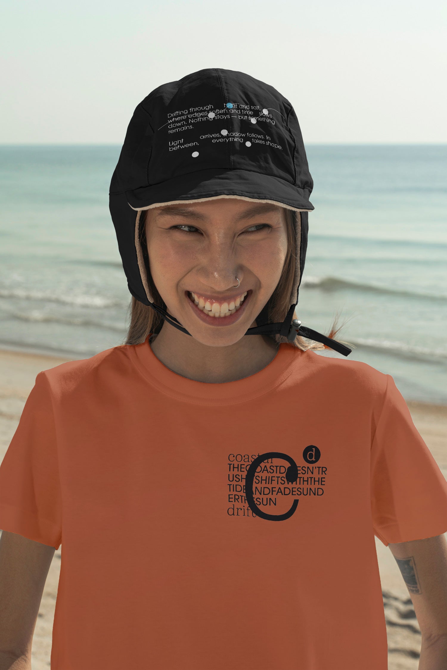 Aviation flap cap and T-shirt mockups worn by local creative Nae along the coast of Hua Hin, Thailand. Built for showcasing apparel brands, fashion collections, and lifestyle identities.