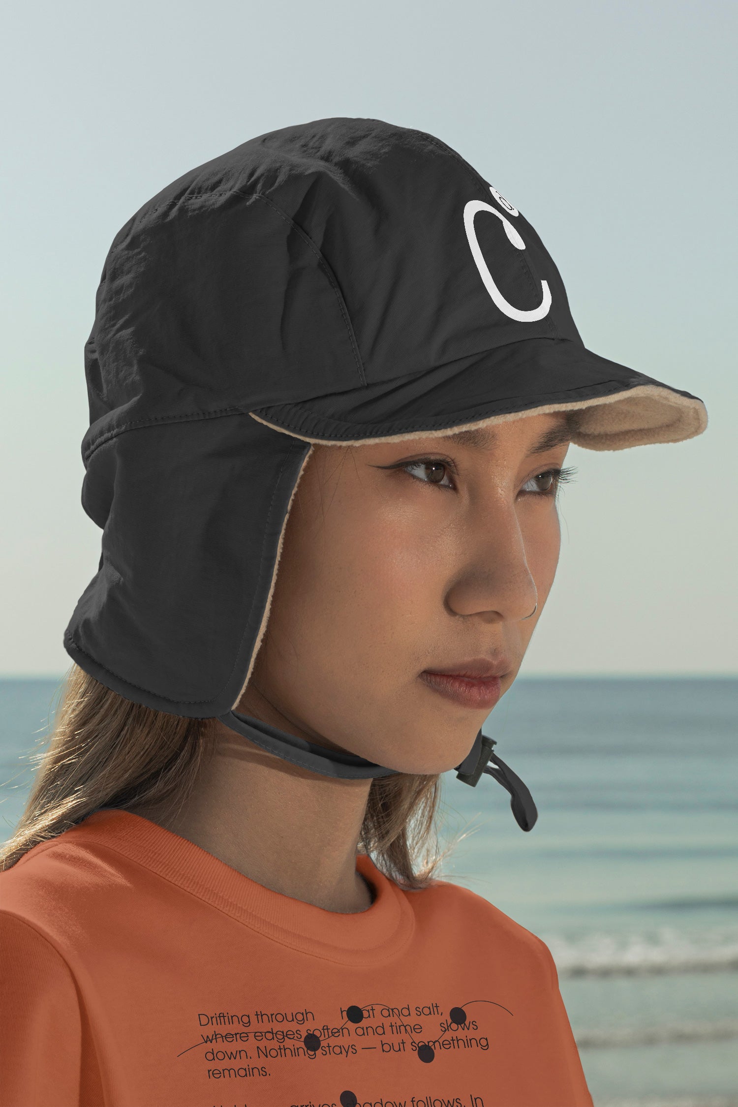 Aviation flap cap and T-shirt mockups worn by local creative Nae along the coast of Hua Hin, Thailand. Built for showcasing apparel brands, fashion collections, and lifestyle identities.