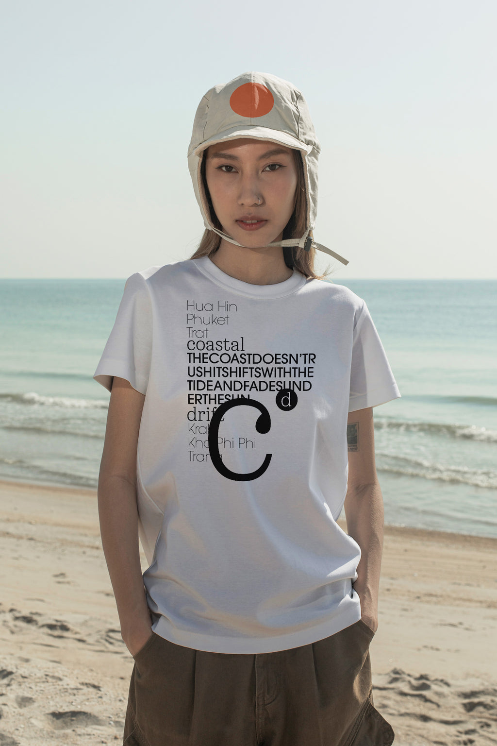 Flap cap and T-shirt mockups worn by local creative Nae along the coast of Hua Hin, Thailand. Built for showcasing apparel brands, fashion collections, and lifestyle identities.