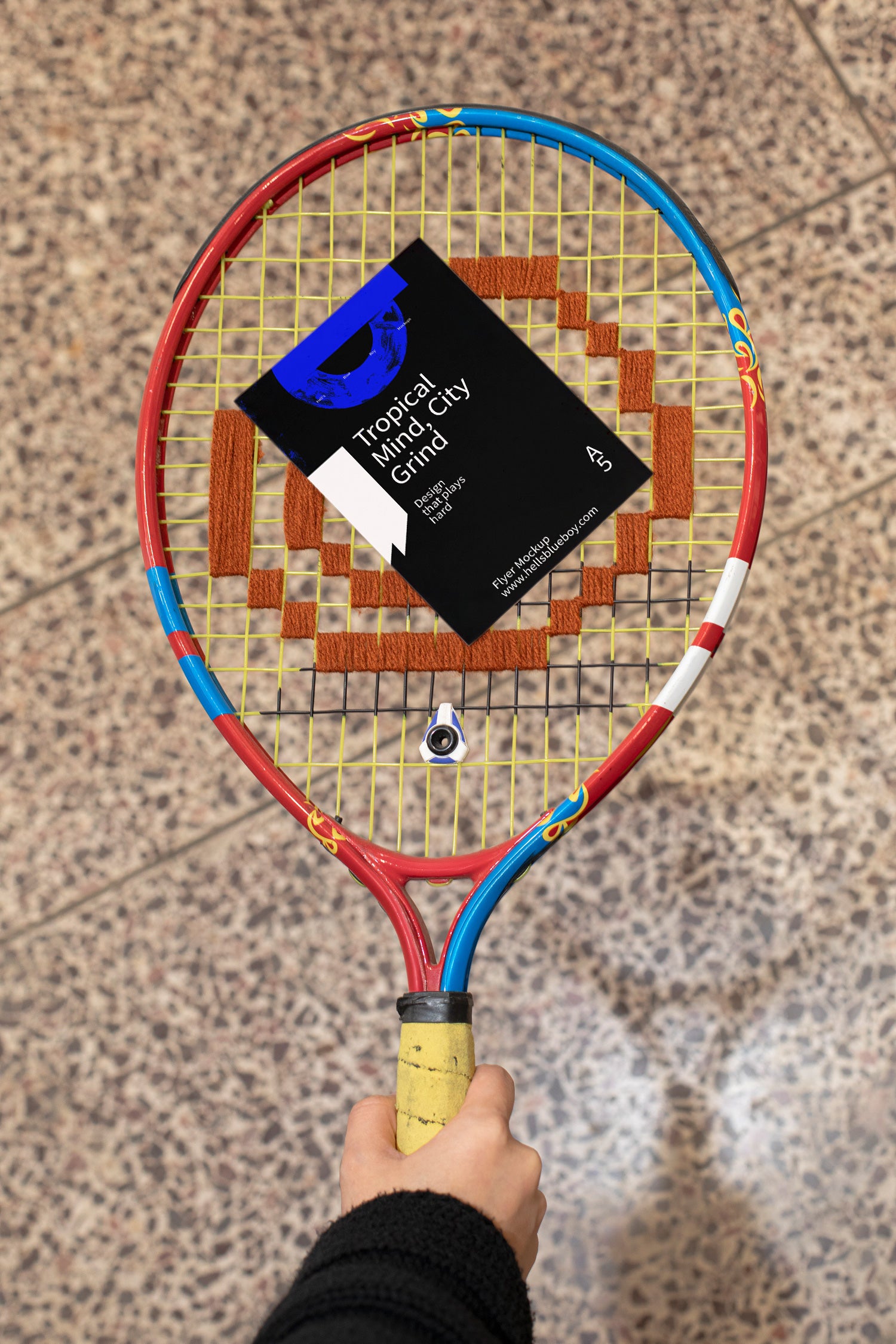 Flyer mockup placed on a tennis racket.