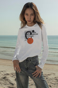 Long sleeve T-shirt mockup worn with jeans at the beach in Hua Hin, Thailand. Built for showcasing apparel brands, fashion graphics, merchandise, and lifestyle identities.