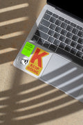MacBook mockup shaped by harsh sunlight, featuring labels and stickers placed directly on the laptop.