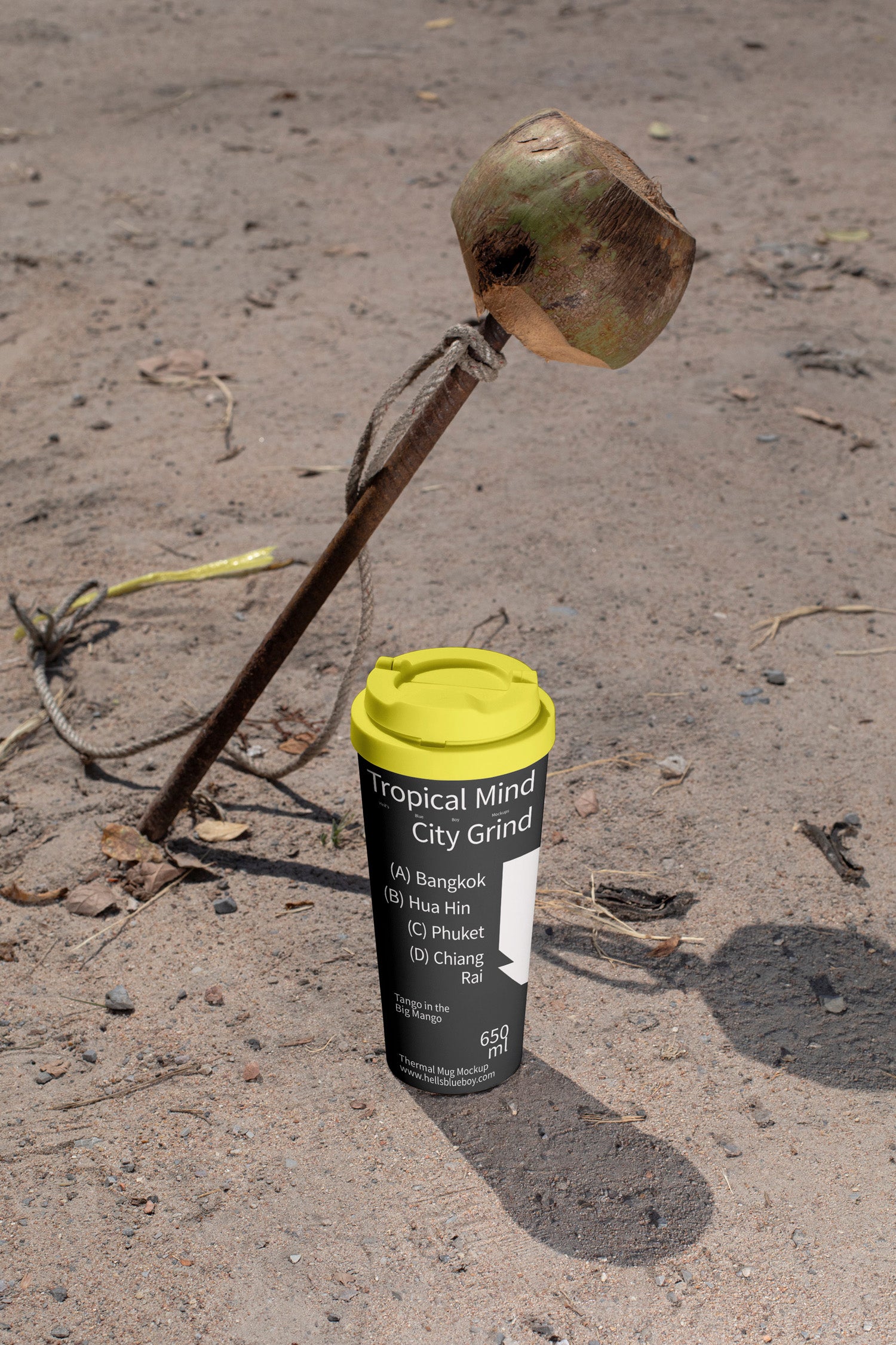 High-resolution thermal mug mockup set against a coconut and steel nail scene.