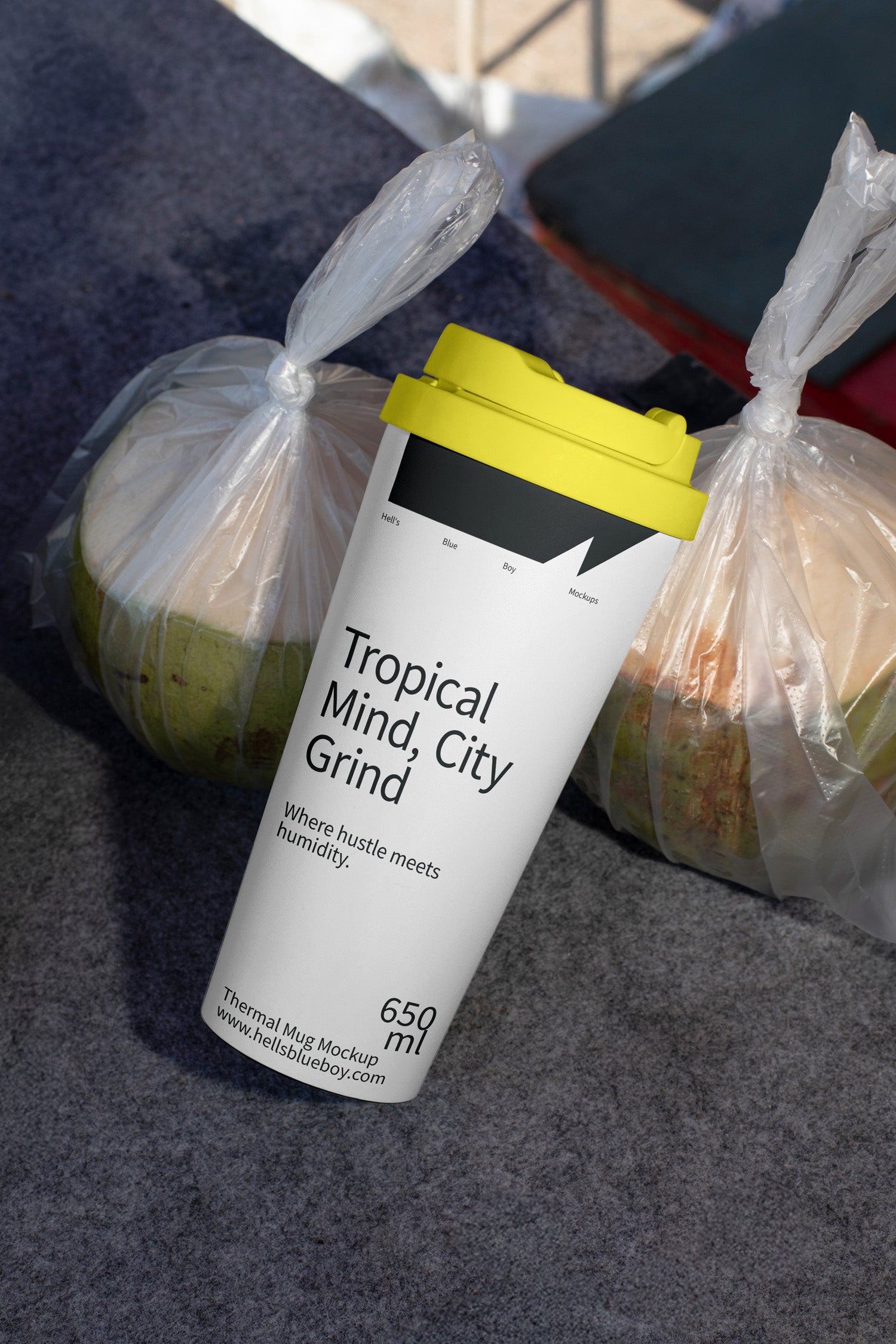 Thermal mug mockup with fresh packed coconuts in the background. Ideal for showcasing branding, logos, and beverage designs in a tropical setting.