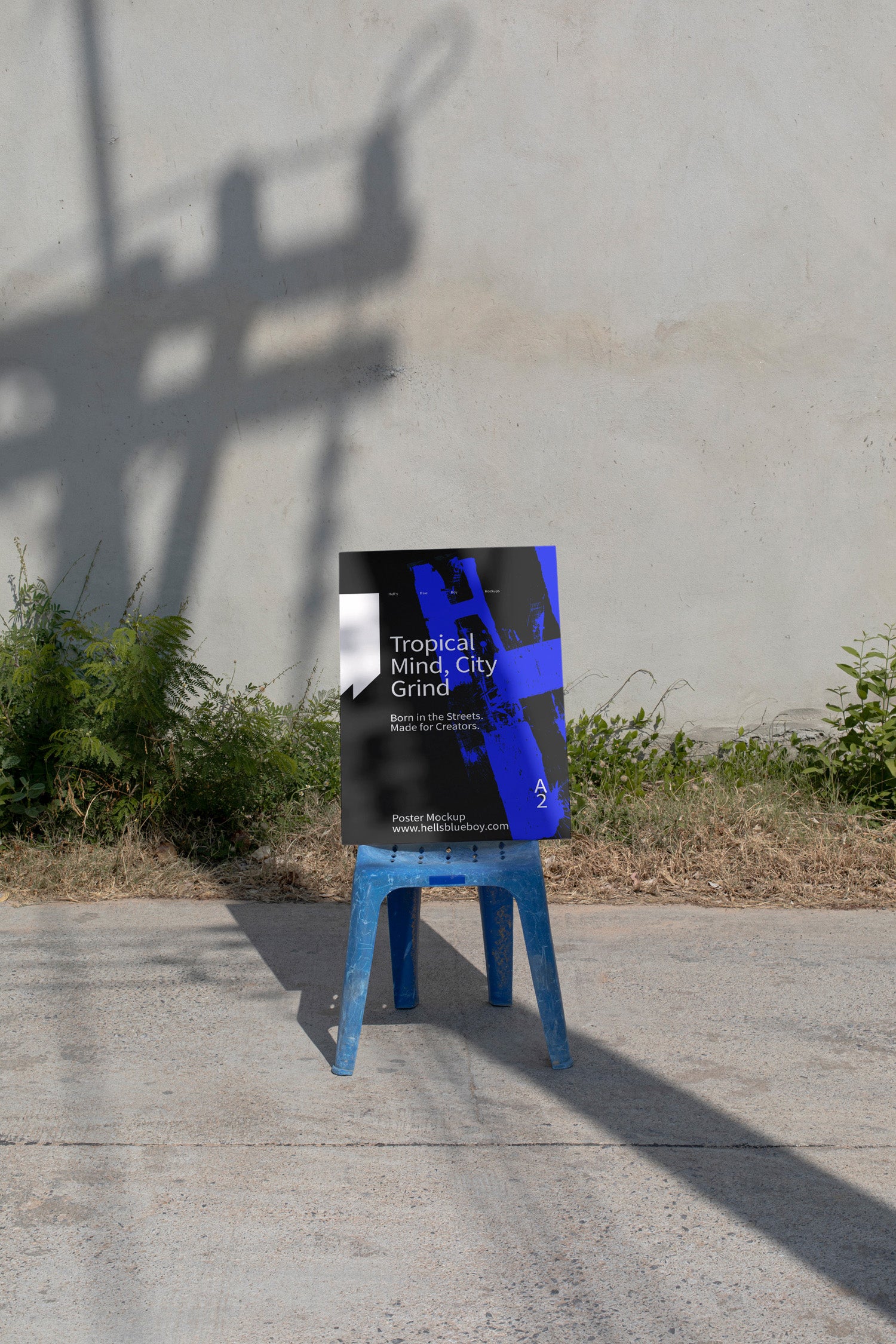 Photorealistic A2 poster mockup set on a blue chair in a rural street scene. Designed for print layouts, typography, and visual branding.