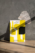 Photorealistic poster mockup leaning against a worn concrete wall with natural shadow play.