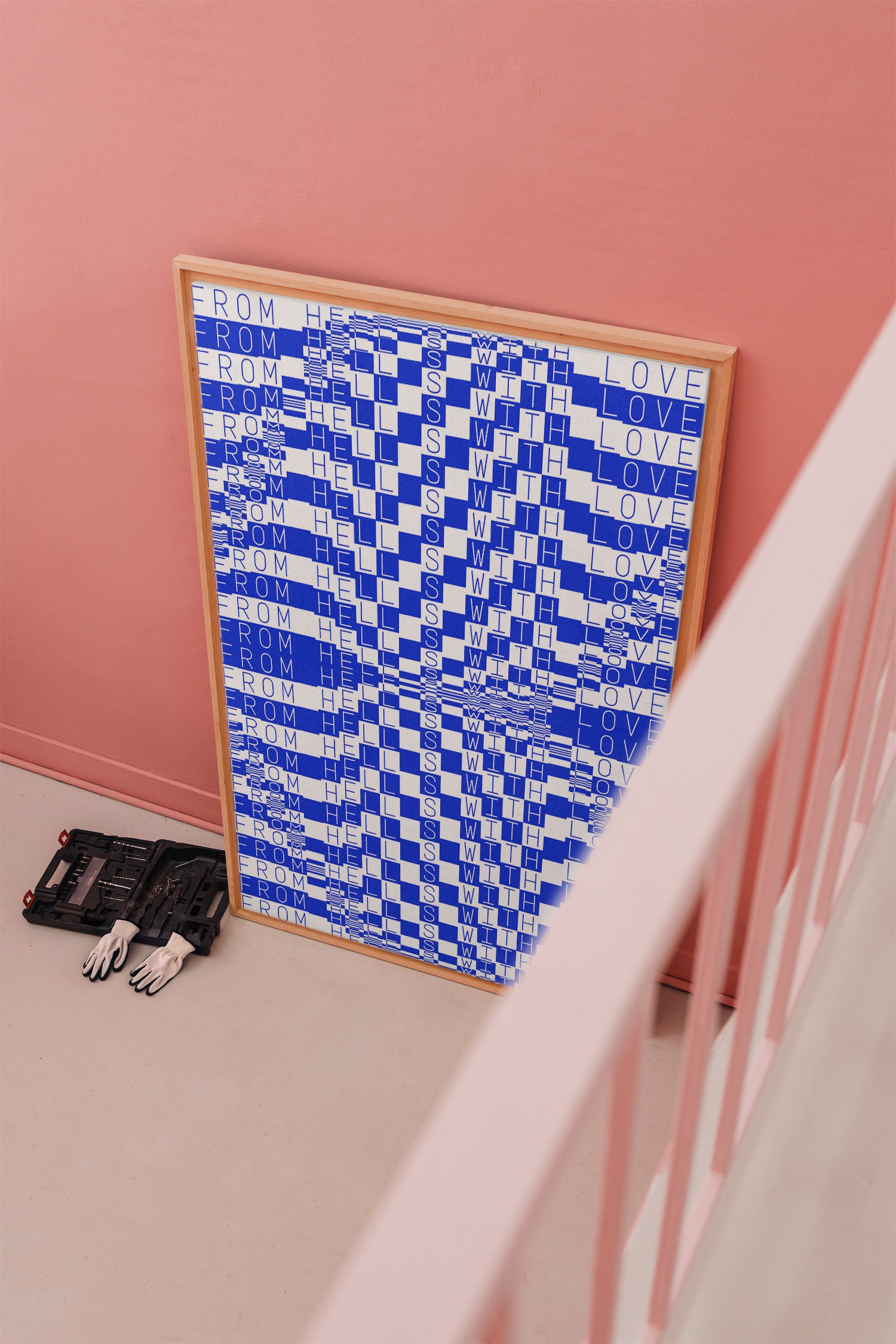 Large format canvas and poster mockup with a wooden frame, leaning against a wall and styled with a toolbox and gloves.