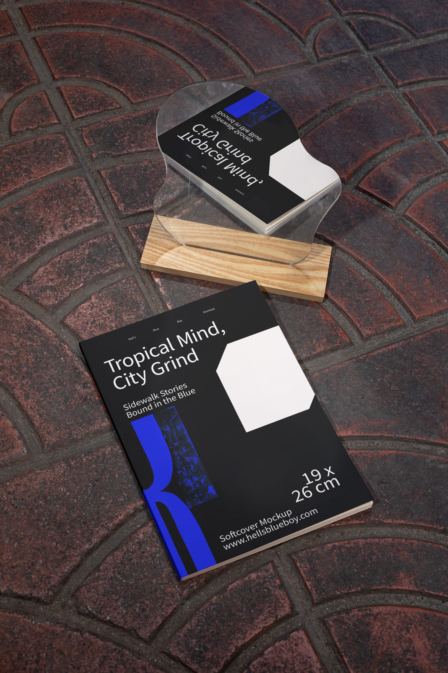 Street-inspired softcover magazine mockup with natural mirror reflection on urban tiled flooring.