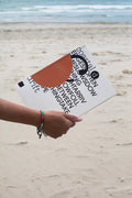 Softcover magazine mockup held against a sandy beach backdrop. Built for showcasing editorial layouts, magazines, branding, photography, and print concepts.