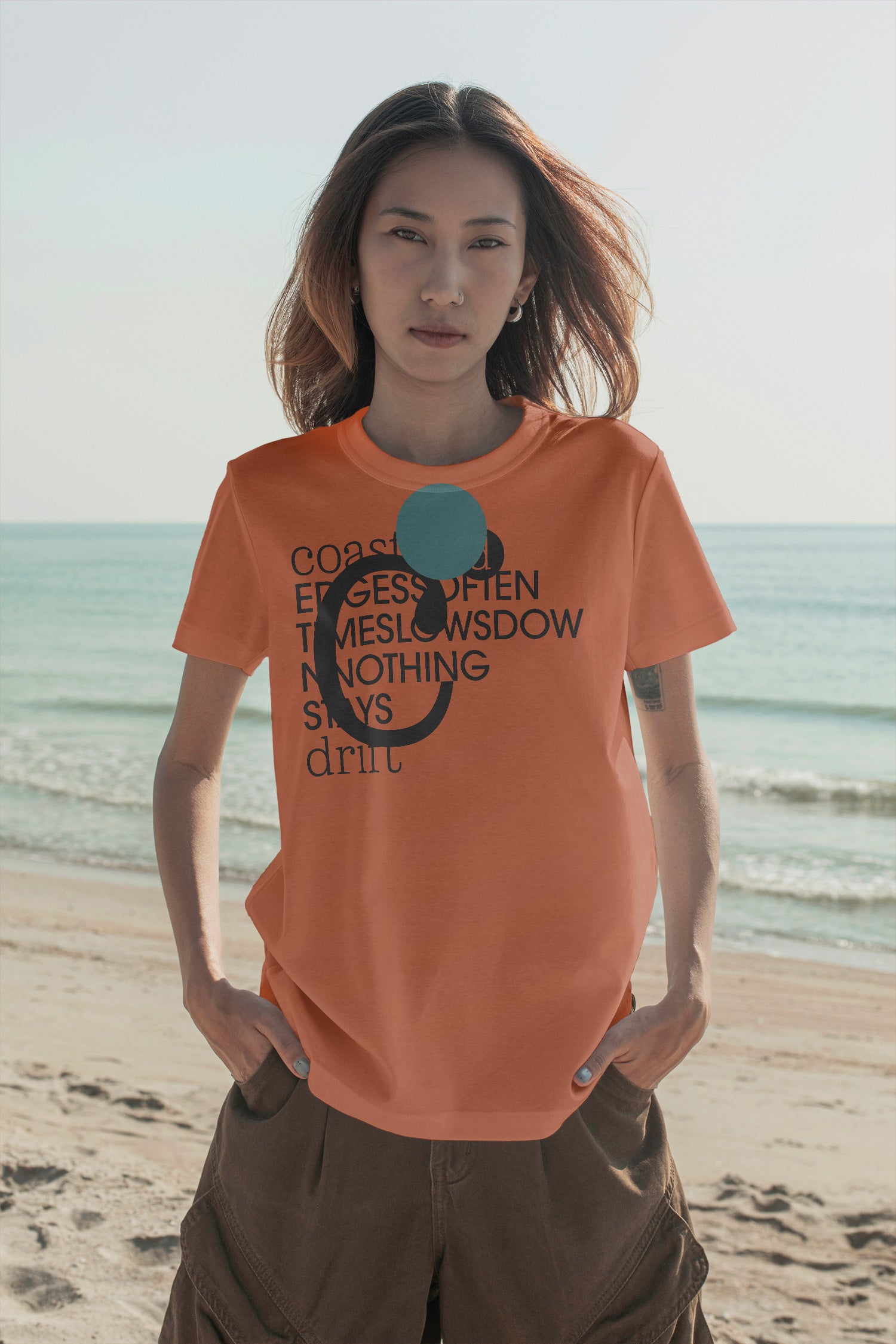 T-shirt mockup at the beach. Built for showcasing apparel brands, fashion graphics, merchandise, and lifestyle identities.