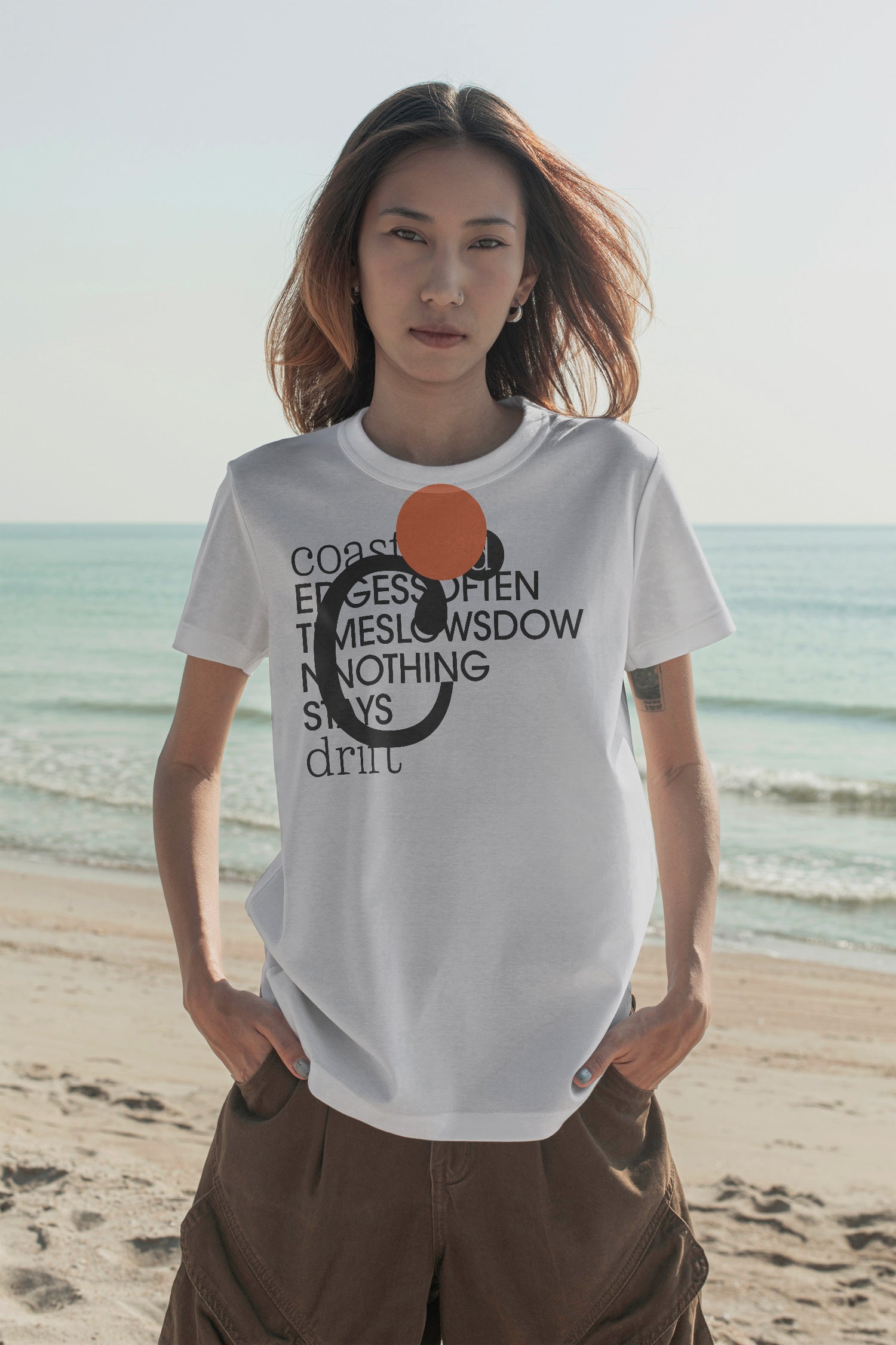 T-shirt mockup at the beach. Built for showcasing apparel brands, fashion graphics, merchandise, and lifestyle identities.