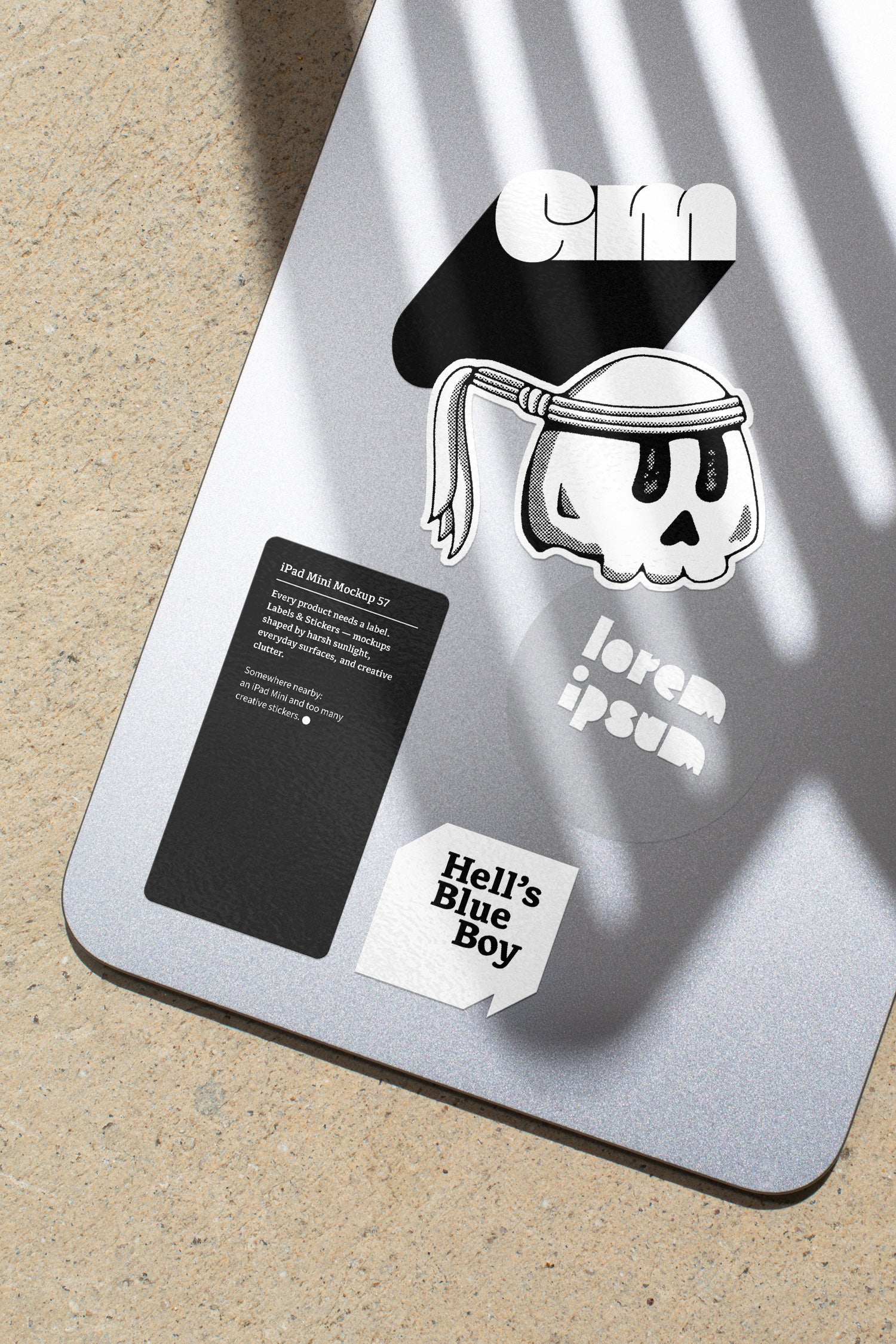 iPad Mini mockup shaped by harsh sunlight, featuring labels and stickers placed directly on the device.