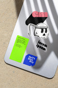 iPad Mini mockup shaped by harsh sunlight, featuring labels and stickers placed directly on the device.