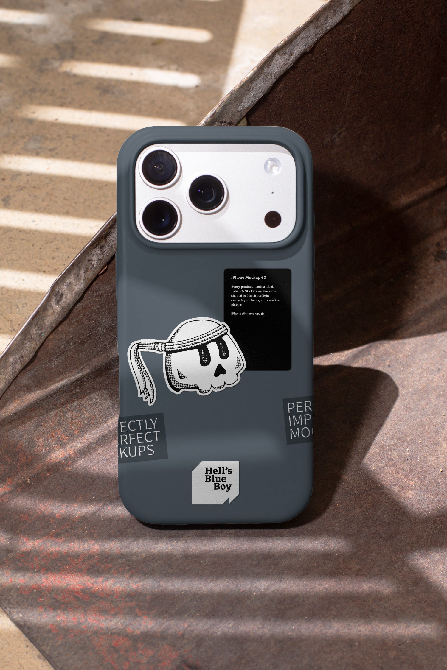 iPhone mockup captured in hard daylight, with labels and stickers applied directly to the case.