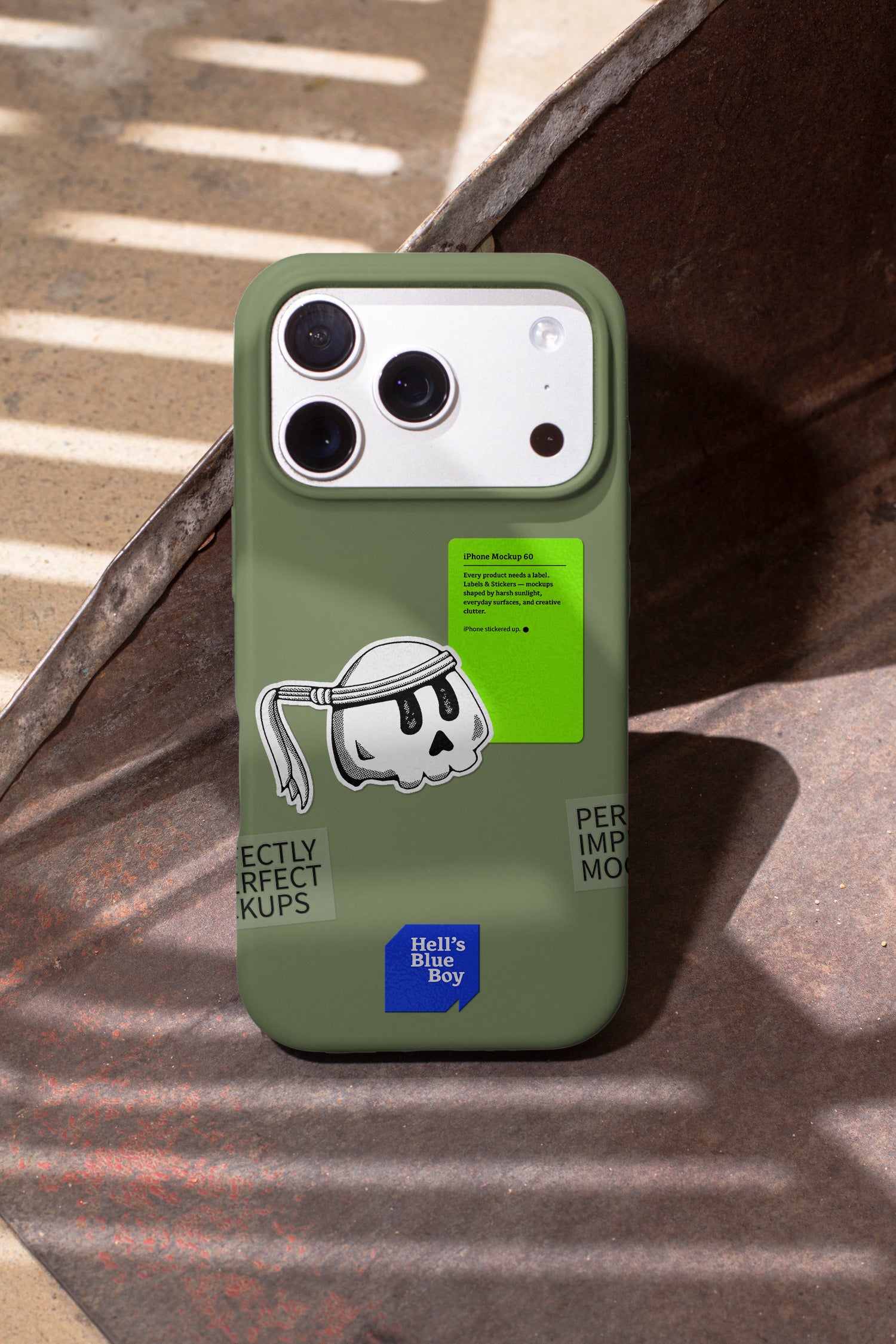 iPhone mockup captured in hard daylight, with labels and stickers applied directly to the case.