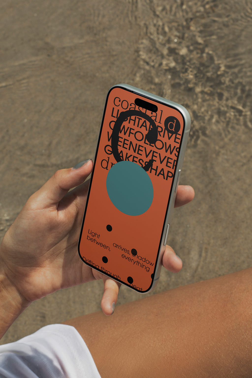 iPhone mockup held above rippling ocean water. Ideal for showcasing app interfaces, branding systems, social media visuals, and digital presentations.