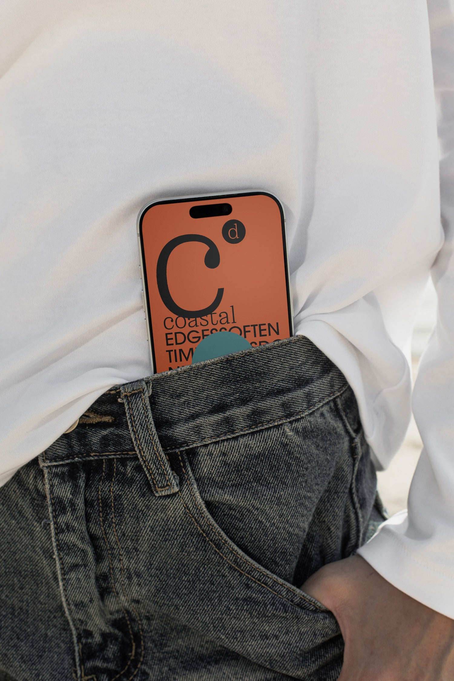 iPhone mockup tucked into denim shorts at the beach in Hua Hin, Thailand. Built for showcasing app interfaces, branding, wallpapers, social media concepts, and digital presentations.