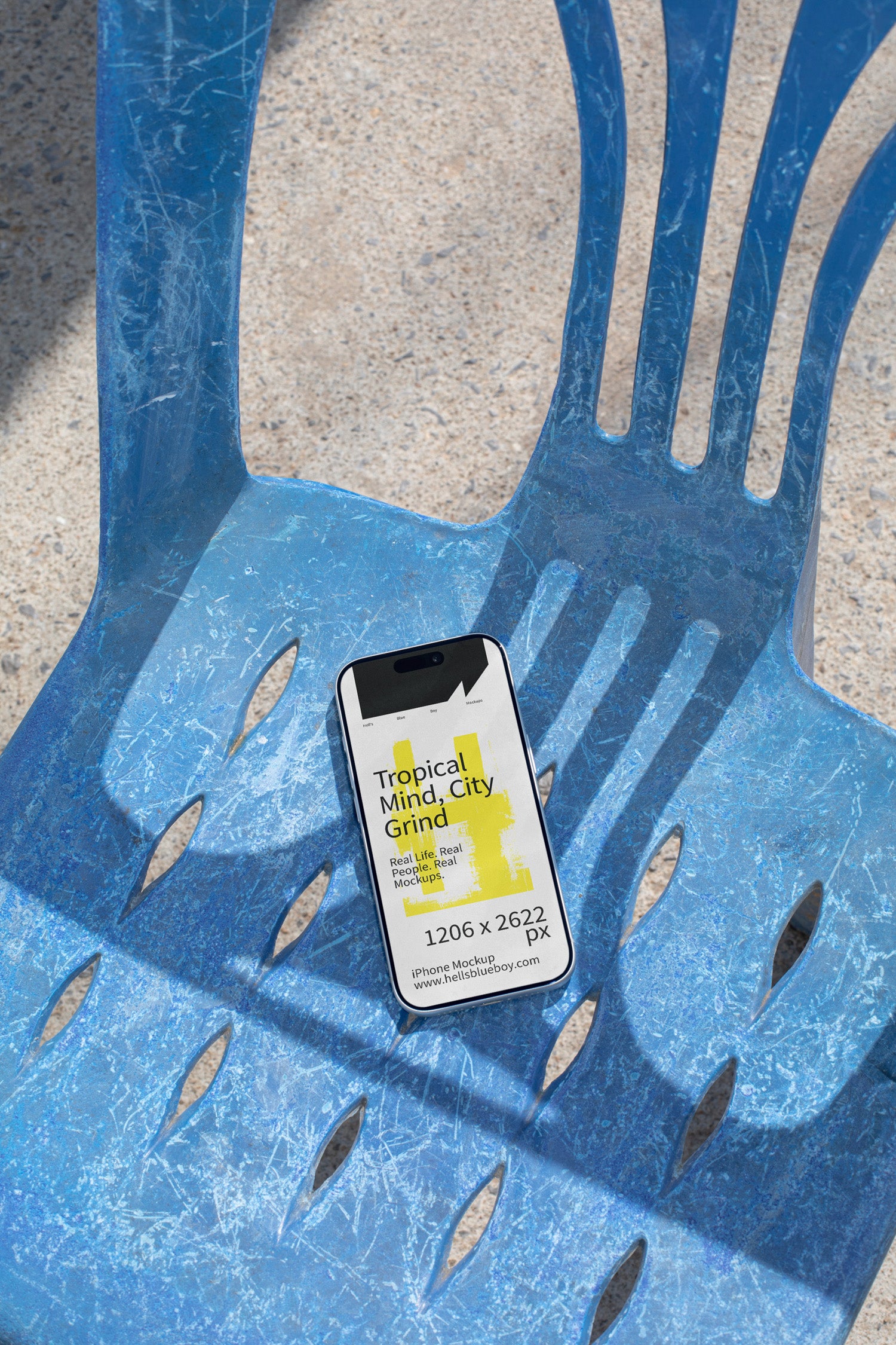iPhone mockup lying on a blue plastic chair with strong shadows. Ideal for showcasing app screens, UI design, and mobile branding visuals.
