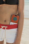 iPhone mockup tucked into bikini bottoms at the beach. Built for showcasing app interfaces, branding, wallpapers, social media concepts, and digital presentations.