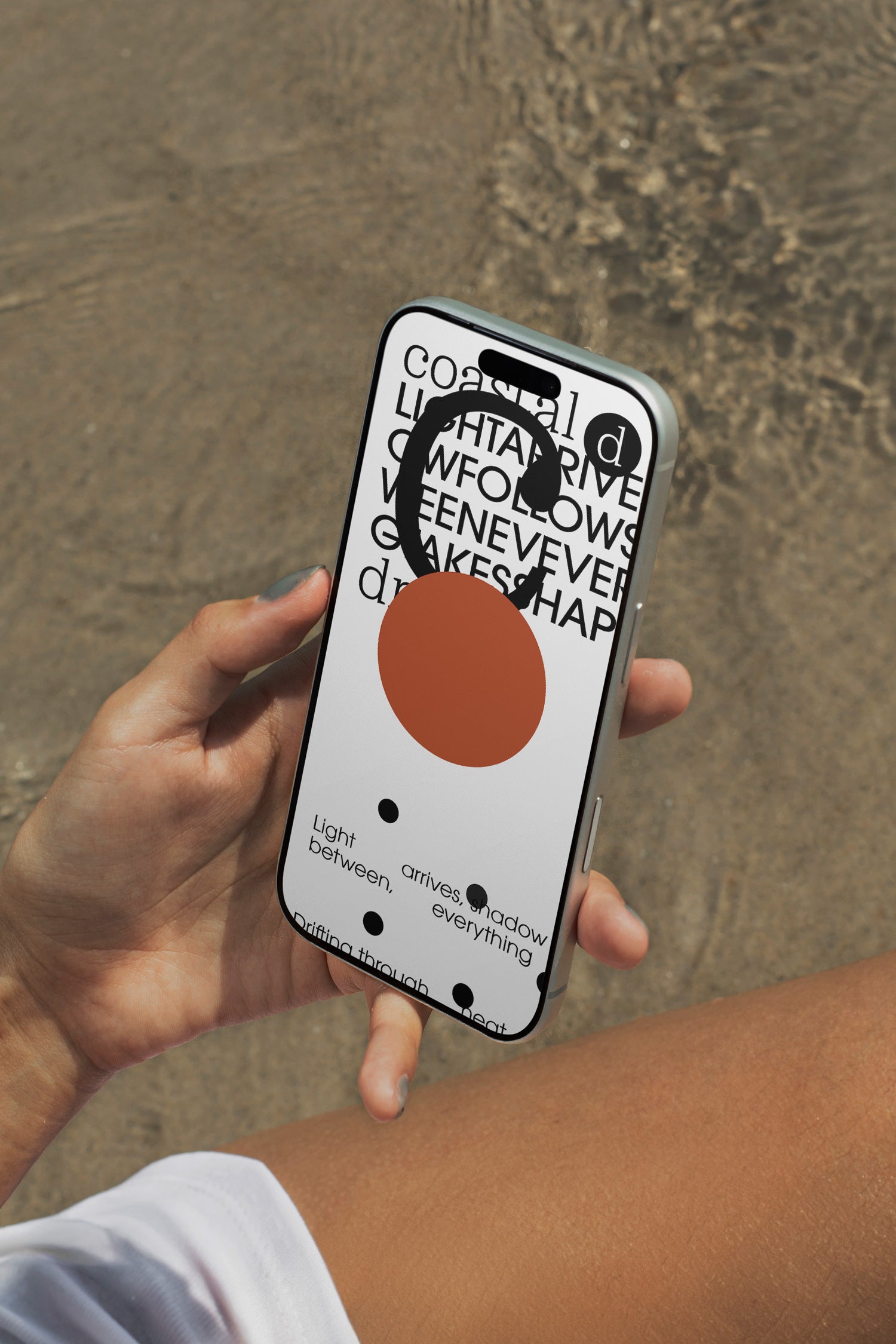iPhone mockup held above rippling ocean water. Ideal for showcasing app interfaces, branding systems, social media visuals, and digital presentations.