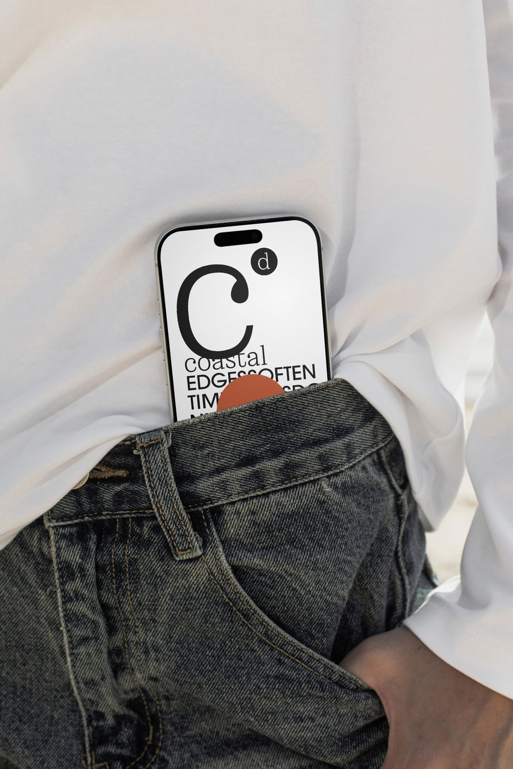 iPhone mockup tucked into denim shorts at the beach in Hua Hin, Thailand. Built for showcasing app interfaces, branding, wallpapers, social media concepts, and digital presentations.